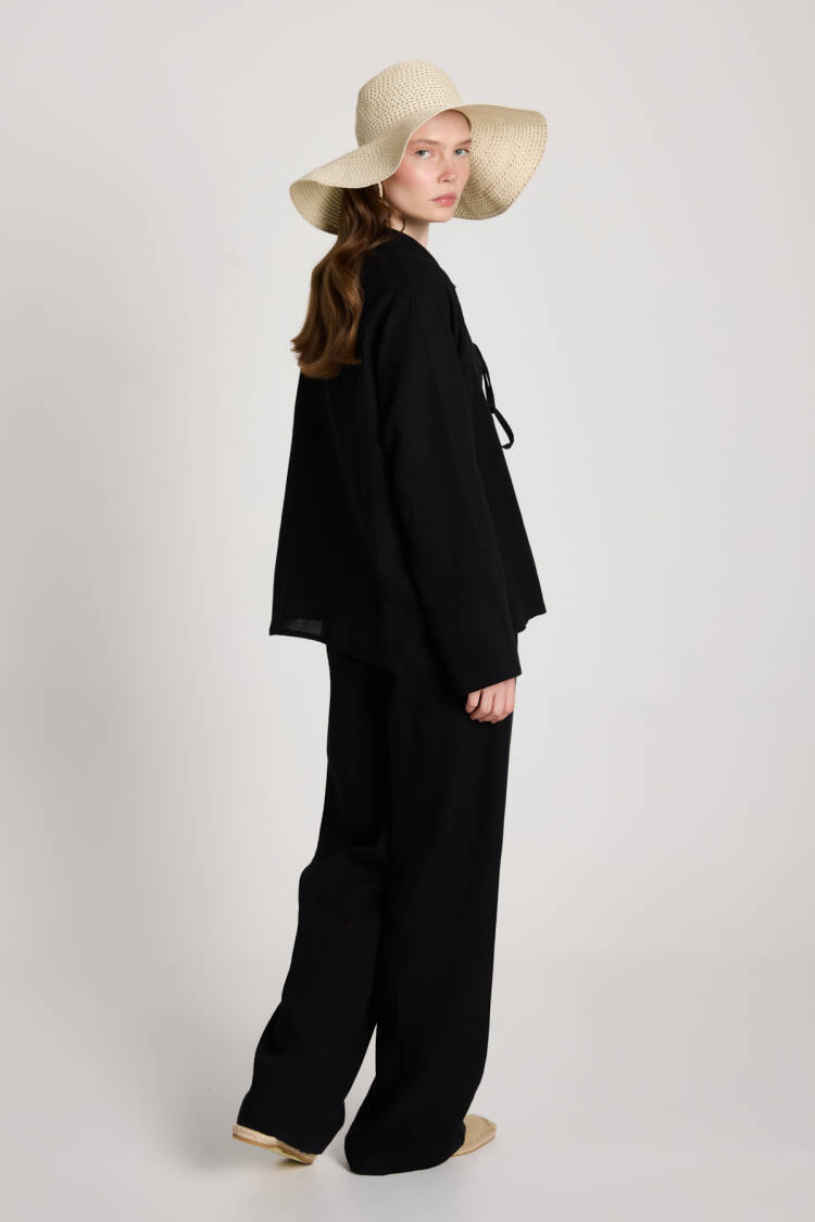 Suit With Notched Neck And Tie Closure