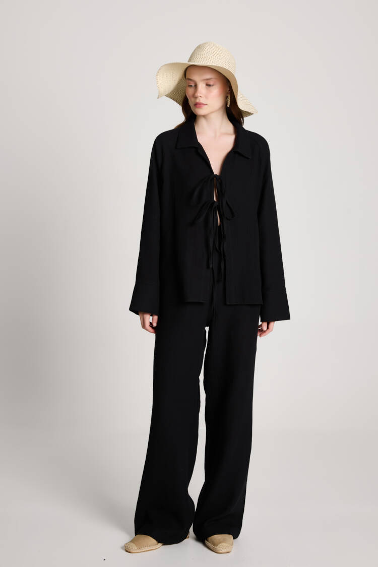 Suit With Notched Neck And Tie Closure