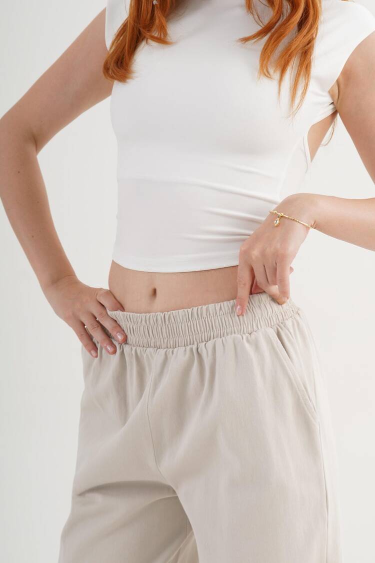 Beige Palazzo Pants With Wide Leg And Slant Pockets